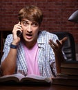 Young handsome student preparing for exams at night Royalty Free Stock Photo