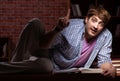 Young handsome student preparing for exams at night Royalty Free Stock Photo