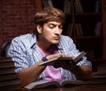 Young handsome student preparing for exams at night Royalty Free Stock Photo