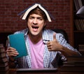 Young handsome student preparing for exams at night Royalty Free Stock Photo