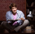 Young handsome student preparing for exams at night Royalty Free Stock Photo