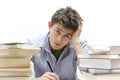 Young handsome student sitting at a table studying