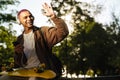 Young handsome stylish short-haired smiling happy boy in headphones Royalty Free Stock Photo