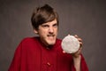 Young man in red shirt on grey Royalty Free Stock Photo