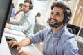 Young handsome technical support dispatcher working in call center Royalty Free Stock Photo