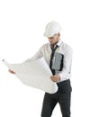 Young handsome technician working with drawing plans on white Royalty Free Stock Photo