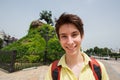 Young handsome teen boy looking at camera and happy smiling over monument to Bohdan Khmelnitsky Royalty Free Stock Photo