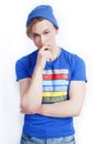 young handsome teenage hipster guy in hat posing emotional, happy smiling against white background isolated, lifestyle Royalty Free Stock Photo