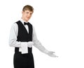 Young handsome waiter gesturing welcome Royalty Free Stock Photo