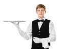 Young handsome waiter holding empty tray Royalty Free Stock Photo