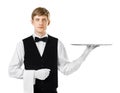 Young handsome waiter holding empty tray Royalty Free Stock Photo