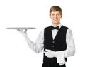 Young handsome waiter holding empty tray Royalty Free Stock Photo