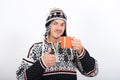 Young handsome winter man with cup of coffee