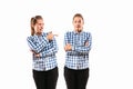 Young handsome woman arguing with herself on white studio background.