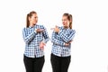 Young handsome woman arguing with herself on white studio background.