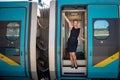 young handsome woman on a train leaves for a business trip to see a business partner Royalty Free Stock Photo