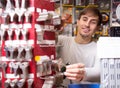 Young handyman offering door keys copies Royalty Free Stock Photo