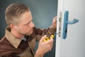 Handyman Repair The Door Lock