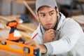 young handyman using spirit level Royalty Free Stock Photo