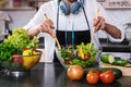 Young happiness Woman Cooking vegetables salad in the kitchen, H Royalty Free Stock Photo