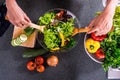 Young happiness Woman Cooking vegetables salad in the kitchen, H Royalty Free Stock Photo