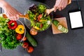 Young happiness Woman Cooking vegetables salad in the kitchen, H Royalty Free Stock Photo