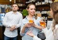 Young happy adults at bar