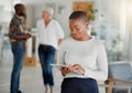 Young happy african american businesswoman holding and using a digital tablet at work. Black female businessperson Royalty Free Stock Photo