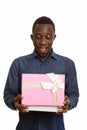 Young happy African man smiling and opening gift box Royalty Free Stock Photo