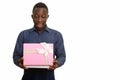 Young happy African man smiling and opening gift box Royalty Free Stock Photo