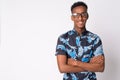 Young happy African tourist man with eyeglasses smiling and crossing arms Royalty Free Stock Photo