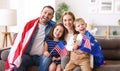 Young happy american family parents and two little kids Independence day of United States at home Royalty Free Stock Photo