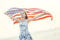Young happy american woman holding USA flag Royalty Free Stock Photo