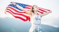 Young happy american woman holding USA flag Royalty Free Stock Photo