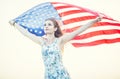 Young happy american woman holding USA flag Royalty Free Stock Photo