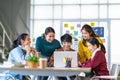 Young happy Asian business man, woman work together in start up office. Creative team brainstorm meeting, internet technology Royalty Free Stock Photo