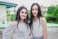 Young happy Asian girls best friends smile standing together and having fun looking at camera Royalty Free Stock Photo