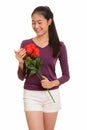 Young happy Asian teenage girl smiling holding red roses ready f Royalty Free Stock Photo