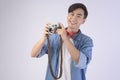 Young happy asian tourist man over white background studio, travel and holidays concept Royalty Free Stock Photo