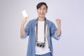 Young happy asian tourist man over white background studio, travel and holidays concept Royalty Free Stock Photo