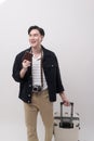 Young happy asian tourist man over white background studio, travel and holidays concept Royalty Free Stock Photo