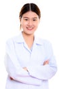 Young happy Asian woman doctor smiling with arms crossed Royalty Free Stock Photo