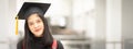 Young happy Asian woman university graduate in graduation gown and cap in the college campus. Education stock photo Royalty Free Stock Photo