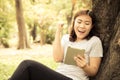 Young happy asian woman using tablet. vintage style Royalty Free Stock Photo