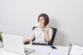 Young happy and attractive asian business woman working at office computer desk smiling drinking cup of coffee relaxed and Royalty Free Stock Photo