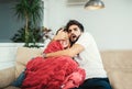 Young happy attractive couple having fun at home enjoying watching tv Royalty Free Stock Photo