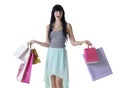 Young happy attractive girl carrying shopping bags isolated on white Royalty Free Stock Photo