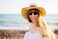 Young smiling girl relaxing at the beach.