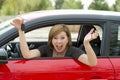 Attractive woman smiling proud sitting at driver seat holding and showing car key in new automobile buying and renting Royalty Free Stock Photo