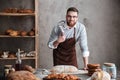 Young happy bearded man wearing glasses baker Royalty Free Stock Photo